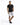 A man stands confidently in a fitted black t-shirt and distressed gray shorts, paired with black sneakers.