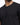 Close-up of a man wearing a fitted black crew neck t-shirt, showcasing fabric and a casual style.