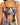 Colorful two-piece set featuring a cropped top with a ruched design and adjustable ties, paired with patterned bottoms.