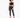 A model poses in a black crochet halter top, paired with high-waisted black skinny jeans and strappy heels.