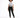 A model stands confidently in a graphic tee and black skinny jeans, paired with stylish black sneakers.