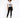 A model poses in a white graphic t-shirt and black skinny jeans, paired with black sneakers.