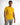 A man wearing a bright yellow polo shirt stands confidently, paired with light gray pants.