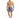 A man stands confidently in colorful swim shorts with a cityscape design, paired with flip-flops.