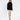 Model wearing a Celine black oversized turtleneck knit sweater with a distressed fringe hem and white mini skirt.