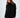Model wearing the Celine black oversized turtleneck knit sweater with a distressed fringe hem.