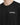 Close-up of a black crewneck shirt featuring white text that reads "challenge" on the chest area.