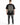 A person wearing a black oversized t-shirt with a checkerboard design and motivational text on the back.