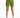 Form-fitting green shorts with a high waist, paired with white athletic shoes, displayed against a plain background.