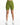 Form-fitting green shorts with a high waist, paired with white athletic shoes, displayed against a plain background.