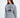 Woman in an oversized light grey Sailing Top with a black circular ship graphic, a modern streetwear essential.