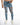 Kase Blue Washed Denim Jeans for men and heavy distressed ripped knees, shown on model with sneakers.