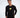 Model wearing Keep On Moving black long sleeve streetwear graphic tee with yellow chest print and white jeans.