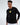 Model in Keep On Moving black long-sleeve graphic streetwear shirt with yellow urban design and Carbon logo.