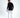 Back view of the black Keep On Moving graphic long sleeve streetwear shirt on a male model with white jeans.