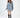 Model wearing the Saylor Sweater, a light blue oversized distressed cable knit pullover on a white background.