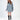 Model wearing the Saylor Sweater, a light blue oversized distressed cable knit pullover on a white background.