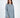 Model wearing the Saylor blue oversized cable knit sweater featuring distressed holes and a loose pullover fit.