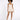 A model poses in a light beige romper with a fitted bodice and flared shorts, paired with black heels.