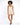 A model poses in a light beige romper with a wrap design and thin straps, paired with black open-toe shoes.