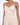 A model wears a light beige, sleeveless, wrap-style top with delicate spaghetti straps.