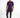 A model stands wearing a purple t-shirt with a graphic design, paired with dark jeans and black sneakers.