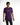 A man wearing a purple short-sleeve shirt with a graphic text design, paired with dark jeans.