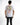 A person wearing a white t-shirt featuring a colorful graphic design on the back, with text elements and a cartoon ch...