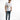 A young man stands confidently in a white t-shirt with a graphic print, paired with distressed blue jeans and white s...