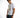 A model poses in a fitted white t-shirt featuring a transparent pocket with printed text, paired with blue jeans.