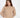 Serena off-white cable knit sweater, ribbed turtleneck, and drop shoulders on a female model.