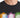 Black t-shirt featuring colorful graphic designs of symbols and the phrase about kindness.