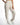 Kinley white wide-leg utility pants with elastic drawstring waist and side pockets for a streetwear aesthetic.