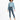 A model wearing a light blue cropped sweatshirt and fitted dark jeans, paired with white slide sandals.