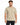 A man wearing a light beige t-shirt with a round neckline and short sleeves, standing against a plain background.