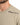 Close-up of a light beige t-shirt featuring black text that reads "LIVE AMPLIFY STYLE" on the shoulder.