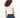 Back view of L.A. Vibes White Crop Top, a streetwear essential paired with dark blue jeans on a curly-haired model.