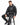 A man sits on a stool wearing a black hoodie and matching sweatpants with a lightning design.
