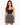 A model poses in a fitted black top and a flared skirt featuring a monochrome animal print design.
