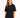 A woman wearing a black oversized tee with short sleeves and a simple white text design, paired with distressed jeans.