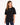 A woman wearing a black oversized tee with short sleeves and a simple white text design, paired with distressed jeans.
