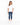 A woman stands in a relaxed pose wearing a white oversized tee and distressed blue jeans with white sneakers.