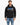 A man wearing a black hoodie with graphic text and a front pocket, paired with light blue jeans.