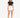 A model stands confidently in a fitted black crop top and white high-waisted shorts, paired with white sneakers.