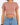 A model wearing a short-sleeve, cropped top in a muted pink color paired with high-waisted denim shorts.