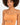 A model with curly hair wears a fitted, sleeveless bodysuit in an orange hue featuring a stylish cutout.