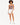 A model poses in a fitted bodysuit with a cutout detail, paired with white shorts and sneakers.