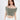A model poses in a soft, off-the-shoulder, cropped top in a muted green shade, paired with a white skirt.