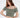 A model poses in a soft, cropped, off-the-shoulder top in a muted green shade, paired with a white skirt.
