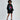 Model in an oversized black hoodie with a pink lips graphic print, ruched sleeves, and front pocket.